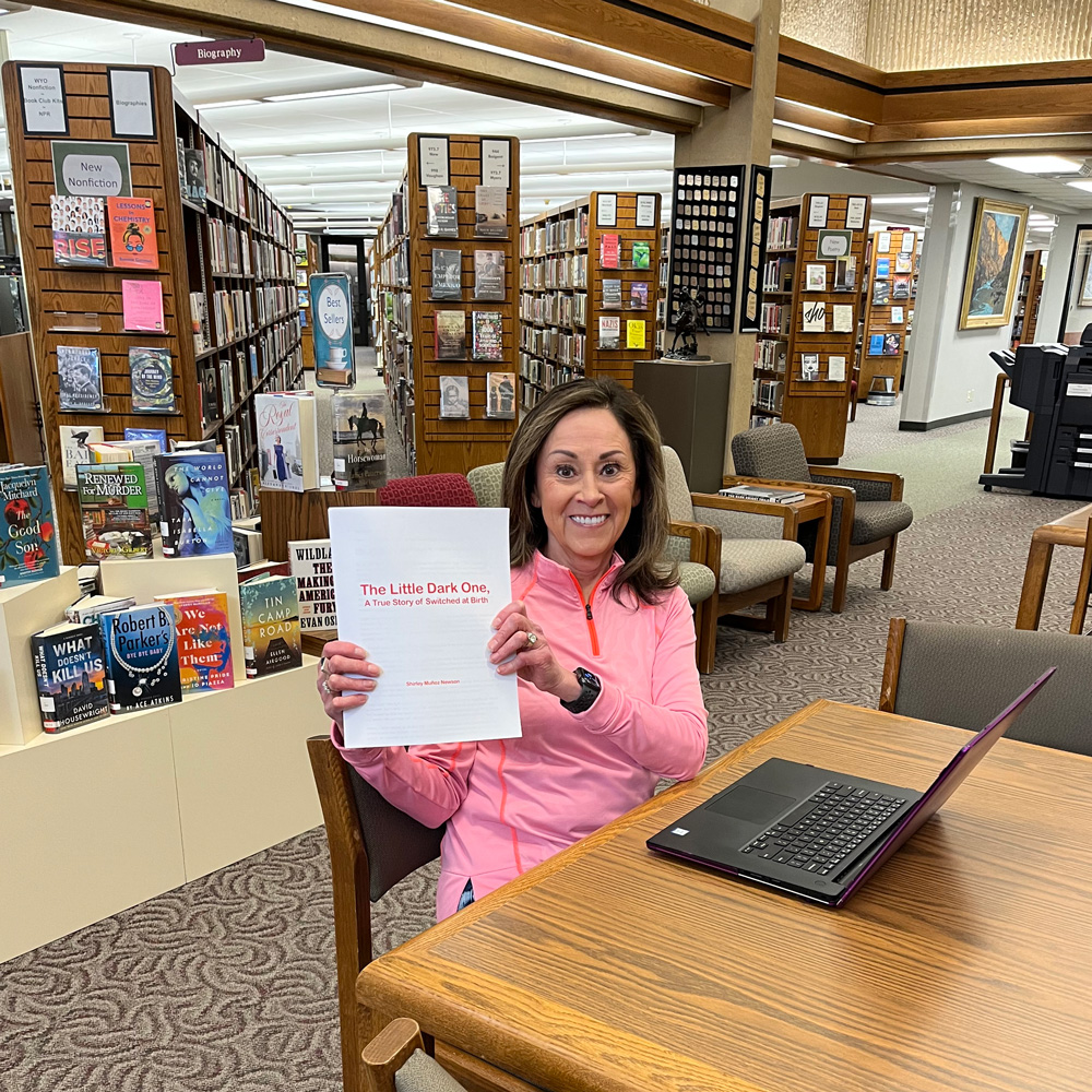 Shirley Muñoz Newson with the Manuscript of The Little Dark One